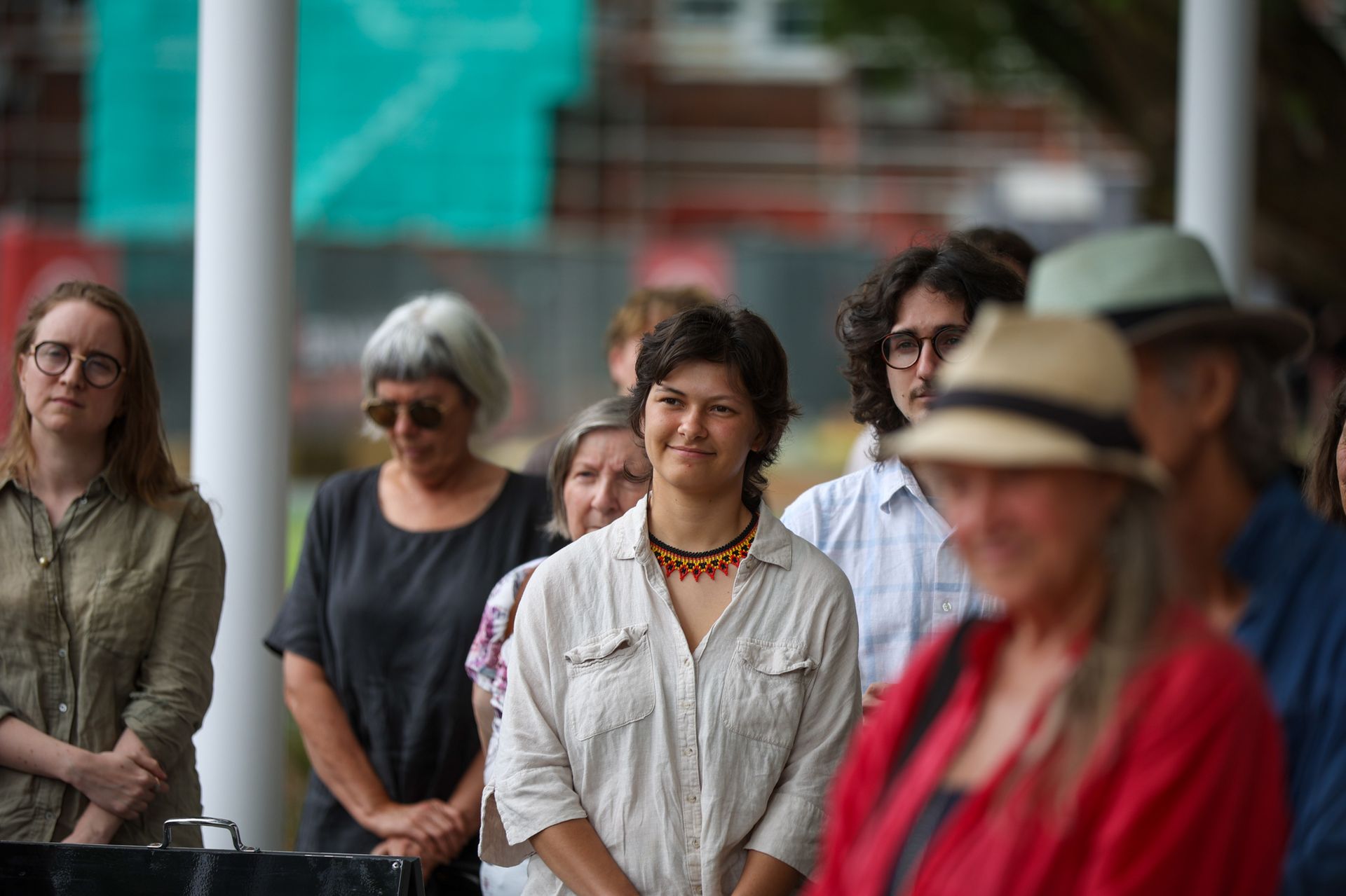 Aria Kitchener standing with community members at a Northern Rivers public event, reflecting his work in cultural education and storytelling.